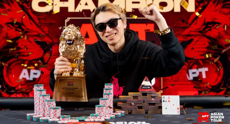 Jianfeng Sun poses with trophy after winning the APT Jeju Main Event